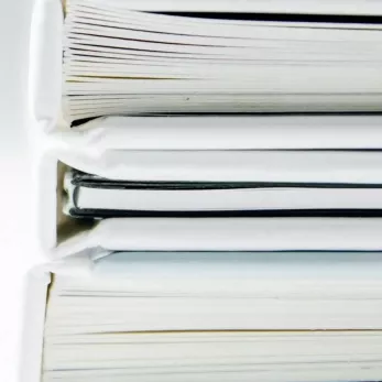 Stacked notebooks. 